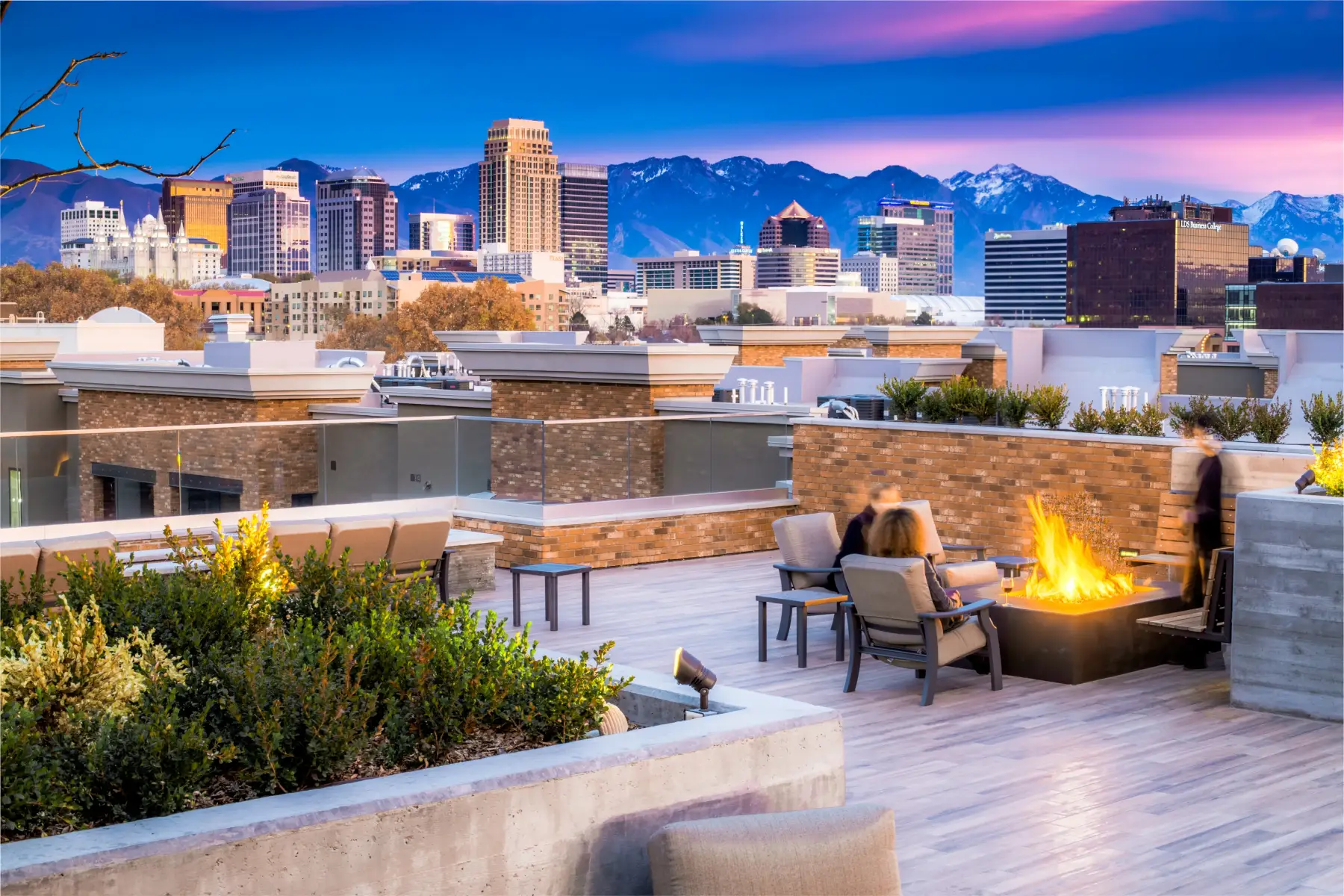 4th West rooftop pool aerial — Salt Lake City skyline beyond. Photo by Lindsay Salazar.