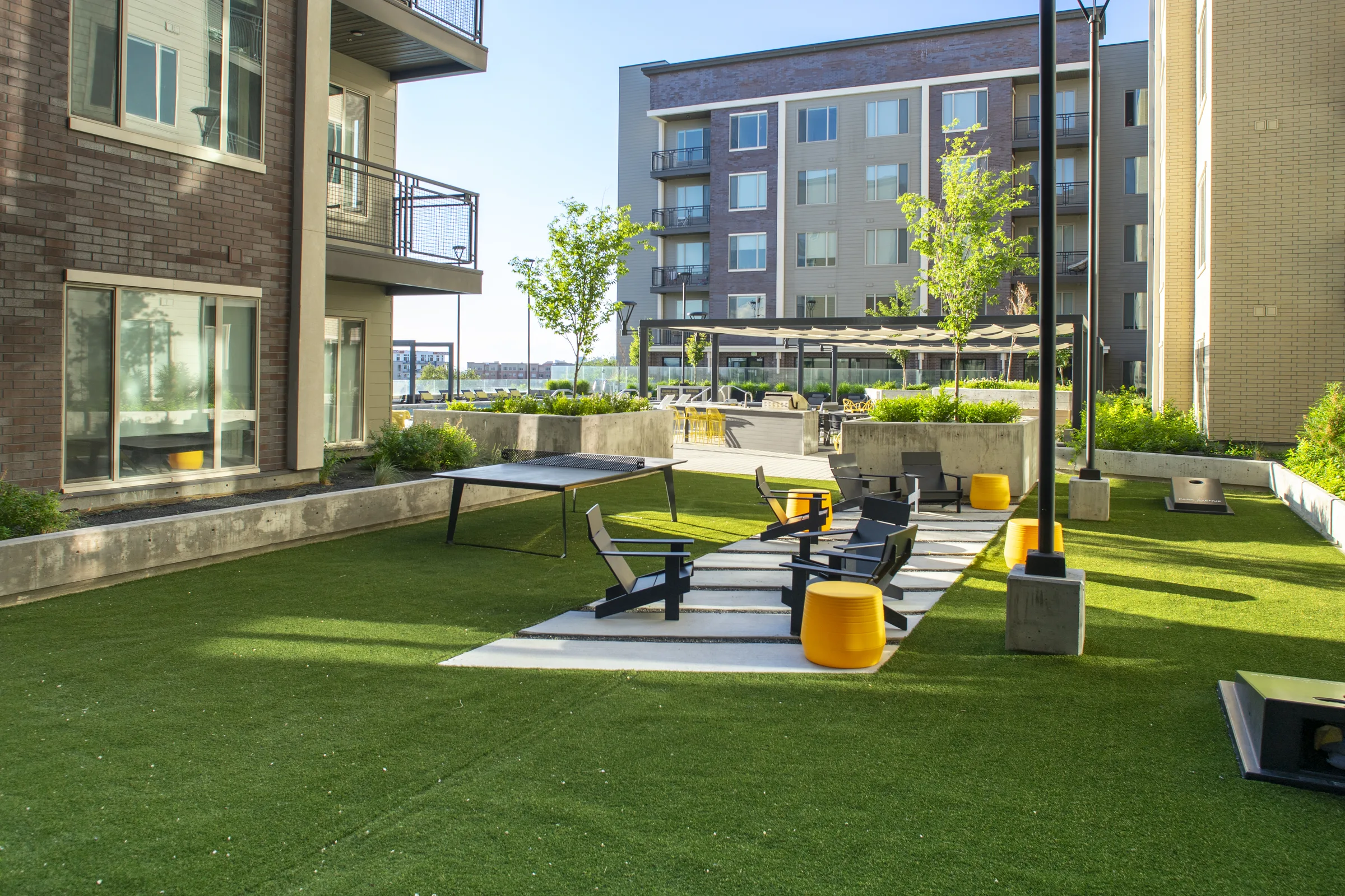 Park Avenue courtyard lawn and ping pong amenity zone